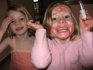 Lindsey and her lipstick; and yes, Nora has tape on her forehead...